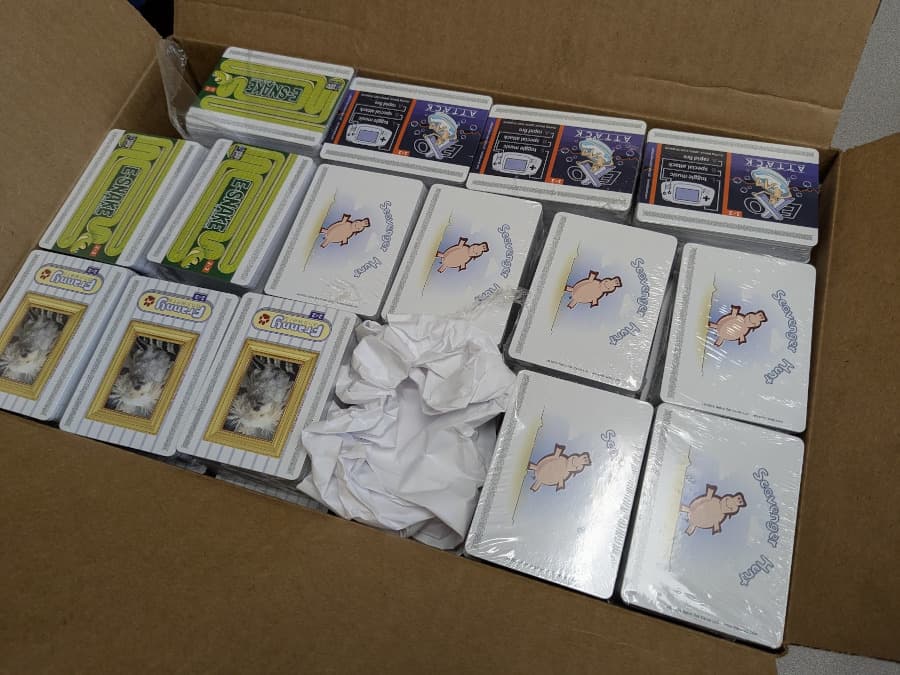 A box of the production cards, as received from the printer