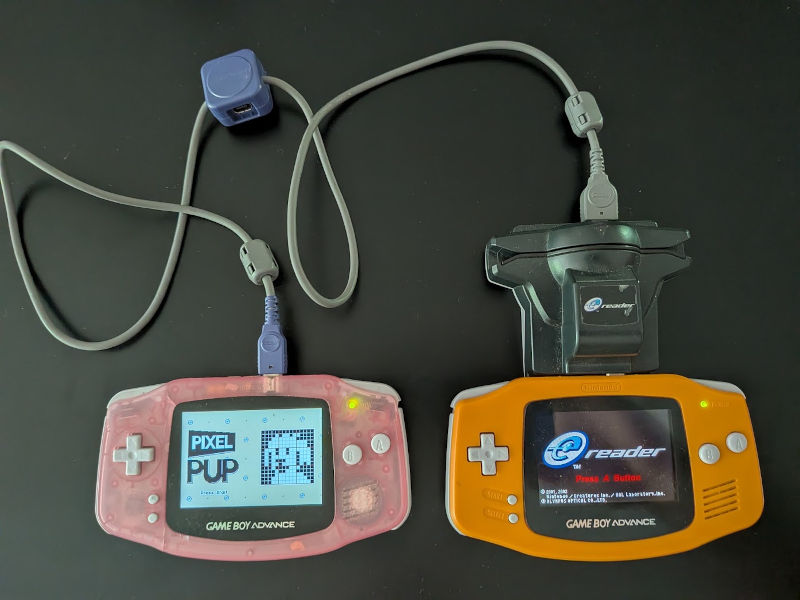 Two GBAs and an ereader, all connected via a link cable